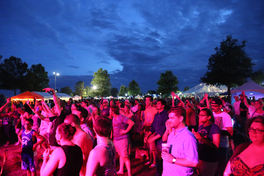 Crowd enjoying an outdoor evening concert at Crave Festival